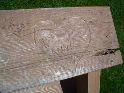 The “Ray Loves Annie” heart-shaped carving that Kevin Costner’s character Ray from the movie Field of Dreams put into the baseball field’s bleachers.  Author: Jesster79 CC BY-SA 3.0 
