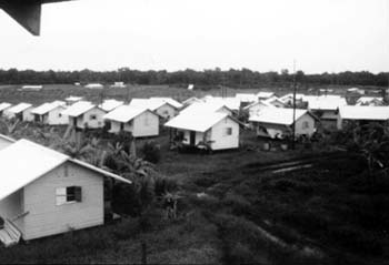 Houses in Jonestown. Author: Photo Courtesy of “The Jonestown report”. CC BY-SA 3.0