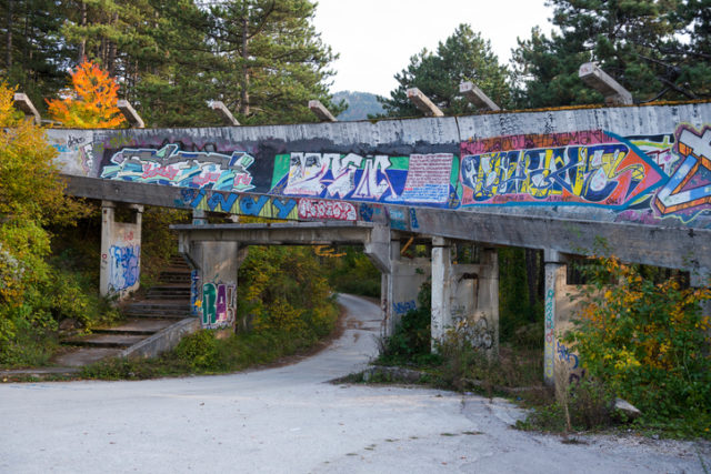 Sarajevo, Bosnia and Herzegovina – October 14, 2013: The abandoned bobsled and luge track from the 1984 Winter Olympics in Sarajevo, Bosnia and Herzegovina. During the siege of Sarajevo (1992-1995), the track was used as an artillery position by Bosnian Serb forces.