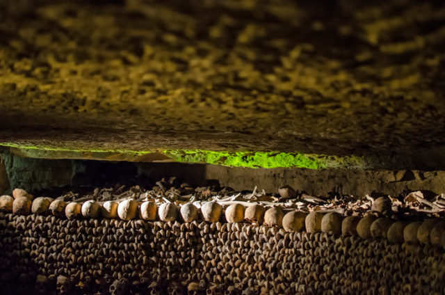 The Catacombs of Paris are located south of the former city gate and hold the remains of about six million people. The skeletons fill a renovated section of caverns and tunnels that are the remains of historical stone mines, giving it its reputation as “The World’s Largest Grave”. Opened in the late 18th century.
