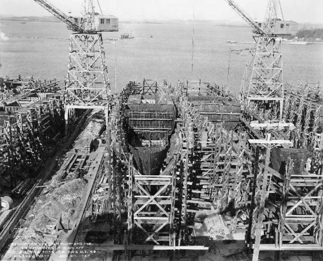Construction of two warships: HMS Calder as USS Formoe (DE-58) and USS Foss on the right.