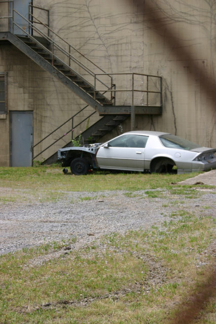 An abandoned car in the prison. Author: Alison Groves CC BY-ND 2.0