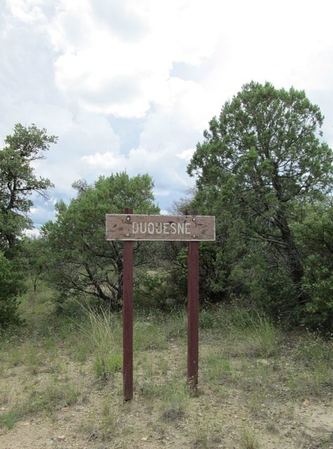 A sign by the road in Duquesne, Arizona. Author: The Old Pueblo CC BY-SA 4.0Photo credit