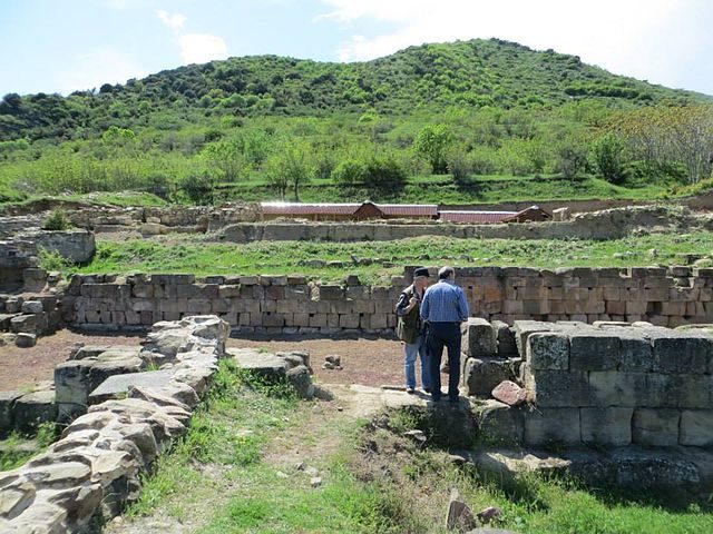 The stone walls of the buildings.