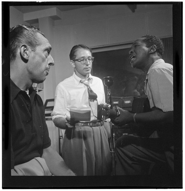 Symphony Sid (left) with Josh White (right), WHOM, New York, in the 1940s. Sid was a regular DJ at the Village Gate. Author: William P. Gottlieb. Public Domain