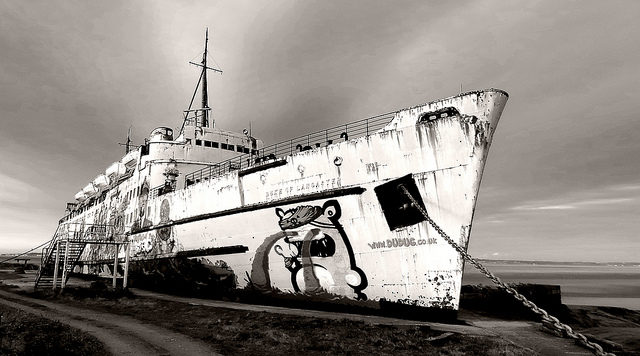 The mural of John ‘Jack’ Irwin bearly visible on the side of the ship. Author Kerys CC BY 2.0