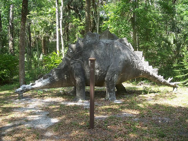 A statue of a concrete stegosaurus from the time when the place was theme park known as Bongoland. Author: Ebyabe – CC BY 2.5