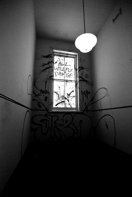 A graffiti-covered window. Author: Nate Robert CC BY 2.0