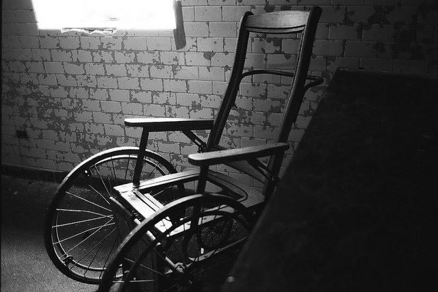 An old type of wheelchair. Author: Dan Grogan CC BY 2.0