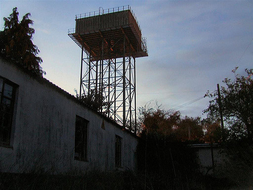 An abandoned tower inside the base. Author: Paulio Geordio CC BY 2.0
