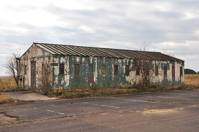 Decaying boarded up barrack. Author: agweightman CC BY-ND 2.0