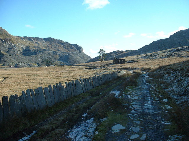 A roofless building in the distance. Author: David Medcalf CC BY-SA 2.0