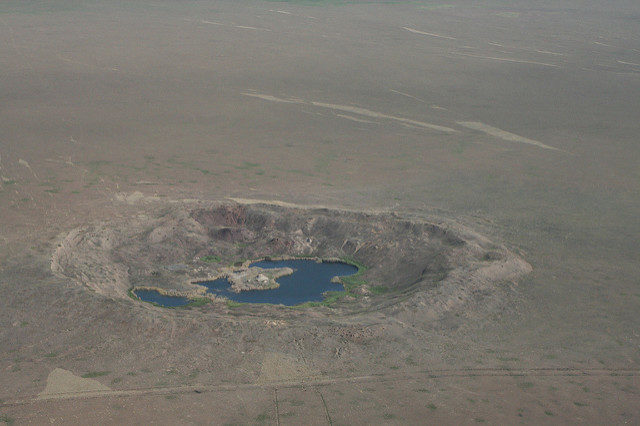 A number of craters created from nuclear tests. Author: The Official CTBTO Photostream CC-BY 2.0