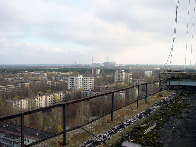 The city of Pripyat and the Chernobyl facility in the distance. Author: Jason Minshull