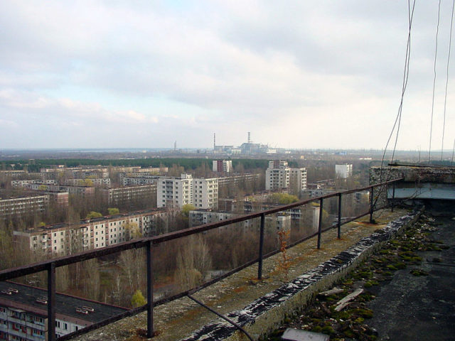 The city of Pripyat and the Chernobyl facility in the distance. Author: Jason Minshull