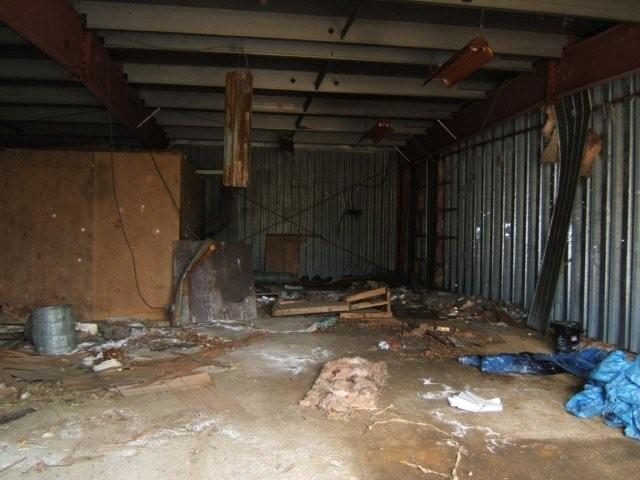 The interior of one abandoned building found at the mine site. Author: Black Tusk CC BY 3.0