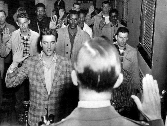 Elvis being sworn into the army. Author: Associated Press/Standard-Sentinel Public Domain