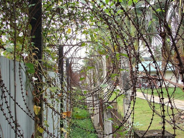 Razor wire around the perimeter. Author: Bjørn Christian Tørrissen – GFDL