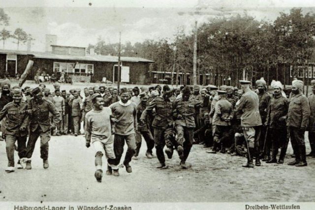 Indians and Zouaves as were also interned as POWs in the camp. These prisoners appear to be enjoying a three-legged race.