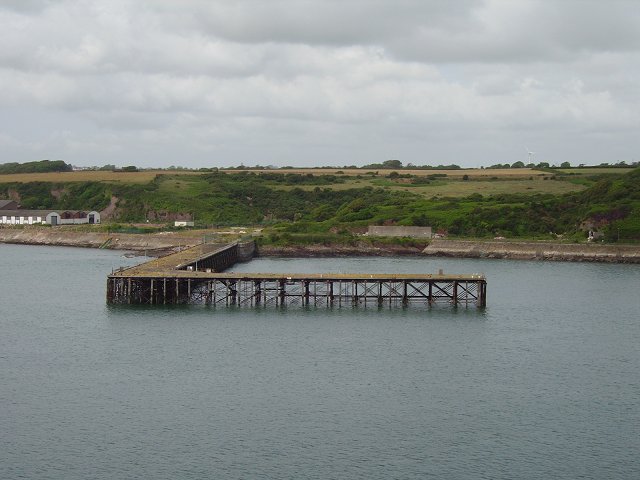 RNMD Milford with disused pier in the foreground. By Richard Webb, CC BY-SA 2.0