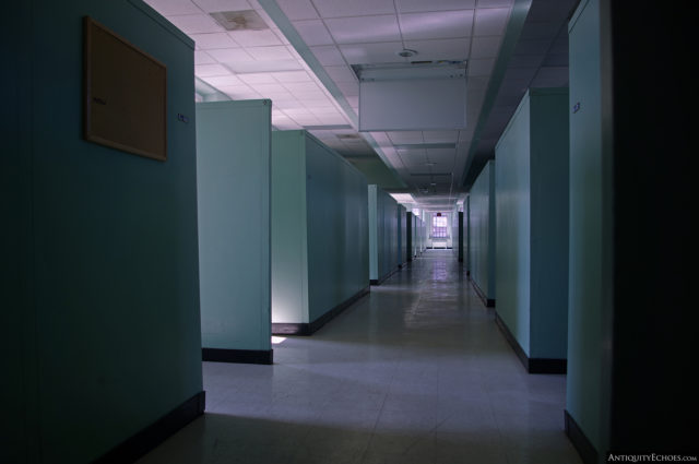 A partially-shadowed hallway in the Allentown State Hospital