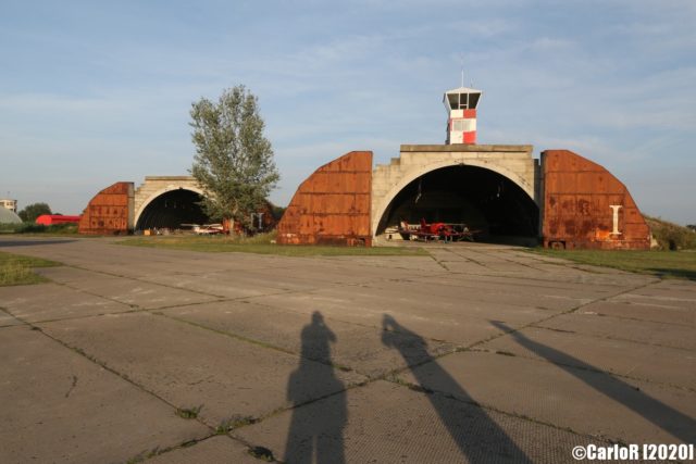 Exterior view of two airplane hangars at Tököl Airbase