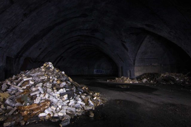 Piles of rubble in a darkened room