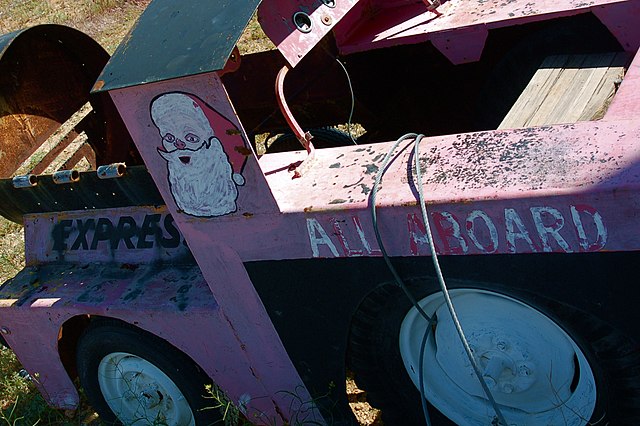 Close up of the first car of a pink children's train