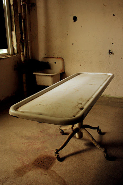 Observation table in the middle of a room at Waverly Hills Sanatorium