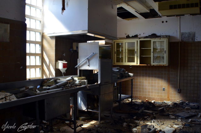 Kitchen in the Hudson River State Hospital covered in debris