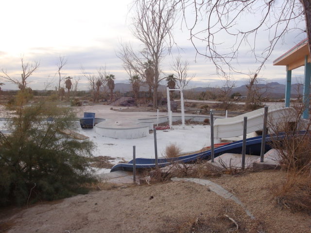 Sideview of waterslides and an empty pool