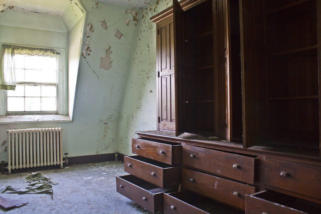 Empty dresser in a derelict room