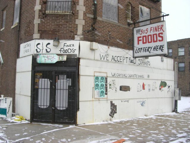 Graffitied exterior of a Gary convenience store