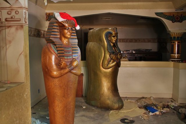 Two sarcophaguses standing in an empty room