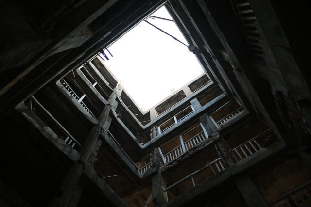 Darkened apartment building stairwell