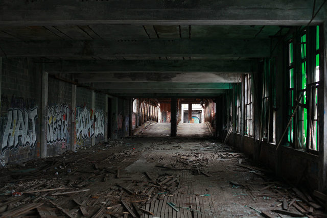 Darkened graffiti-covered hallway