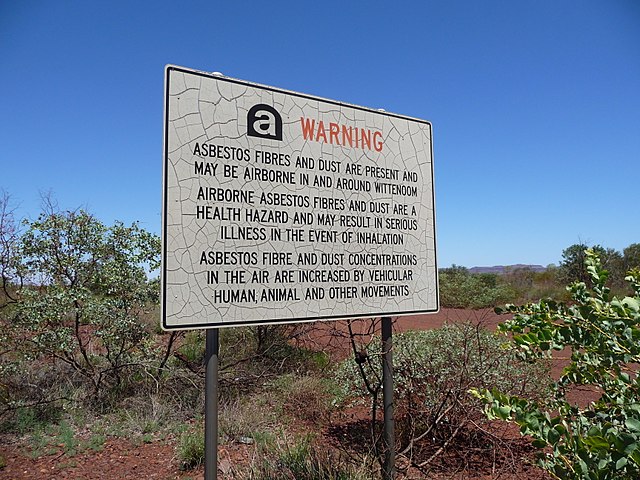 Road sign warning about the presence of blue asbestos