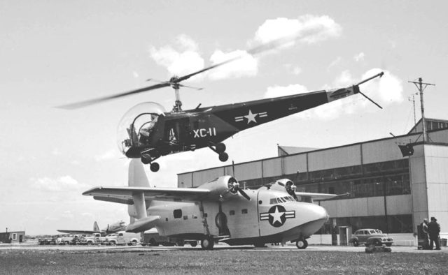 A Bell HTL-1 taking off over a Grumman Albatross prototype at Floyd Bennett Field, May 1948.