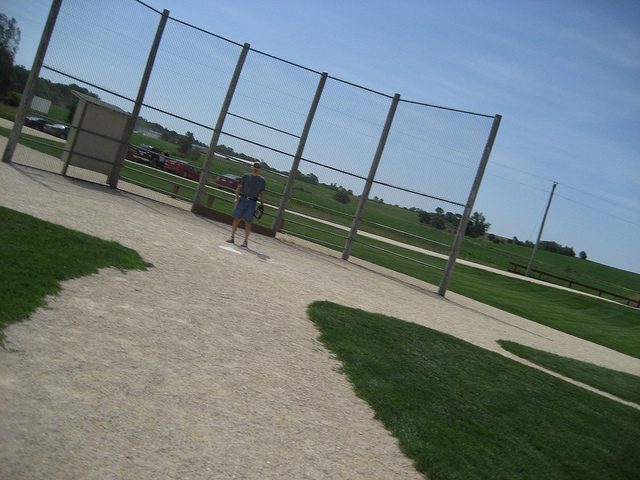 a visitor standing on the home plate. Author: mrsdkrebs CC BY 2.0