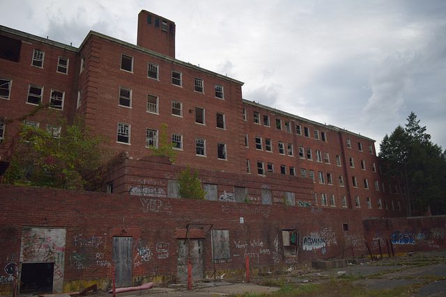 Glenn Dale Hospital with numerous graffiti in the foreground.Author: Preservation Maryland CC BY-SA 2.0