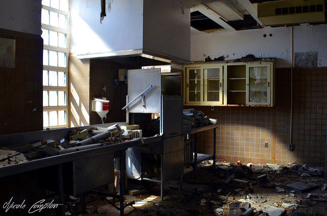 A destroyed kitchen, debris everywhere.