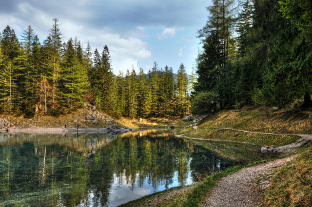 Gruener See, European Alps.Dark clouds reflection in the mountain lake.