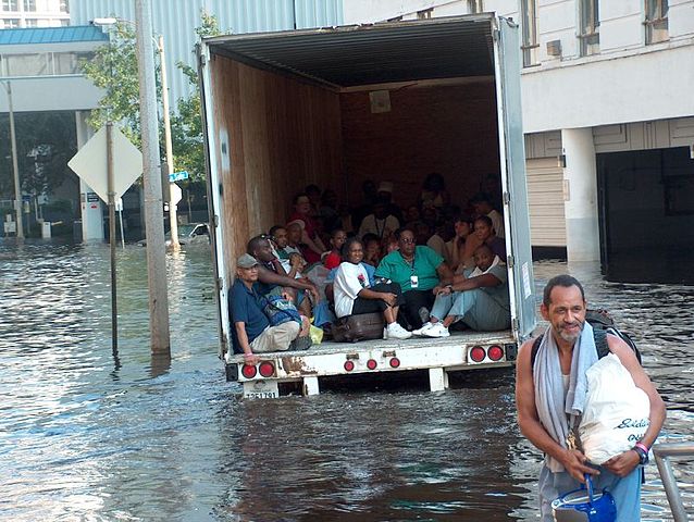 Evacuating by truck through flood waters. Author: Ben Record CC BY-SA 2.0