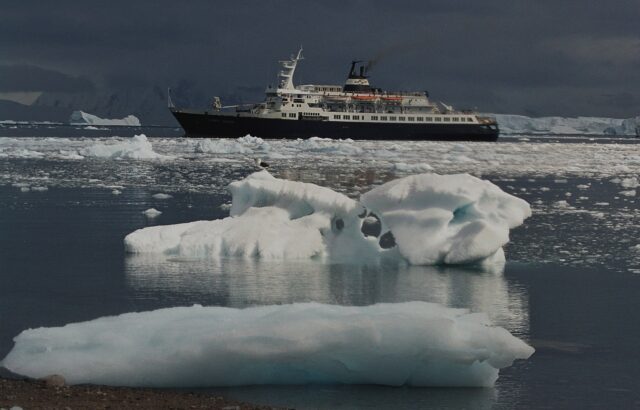 MV Lyubov Orlova sailing past icebergs