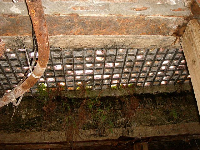 Dusty grate leading from the Seattle Underground to the city above