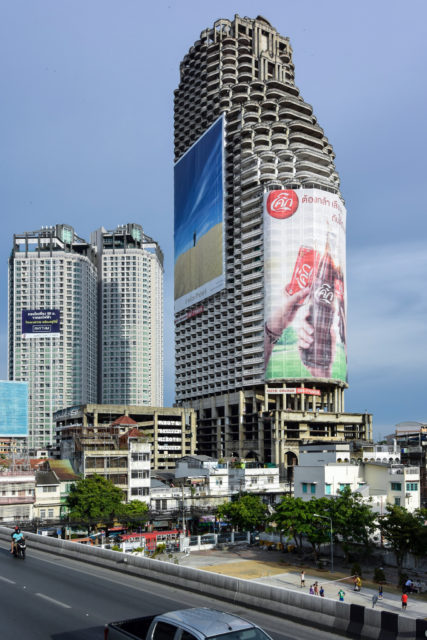 Sathorn Unique Tower and the 10 store parking garage on the left. Photo Credit: m-louis, CC BY-SA 2.0