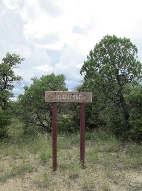 A sign by the road in Duquesne, Arizona. Author: The Old Pueblo CC BY-SA 4.0Photo credit