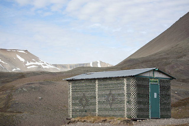 A house made of bottles. Photo Credit: Kitty Terwolbeck, CC BY 2.0