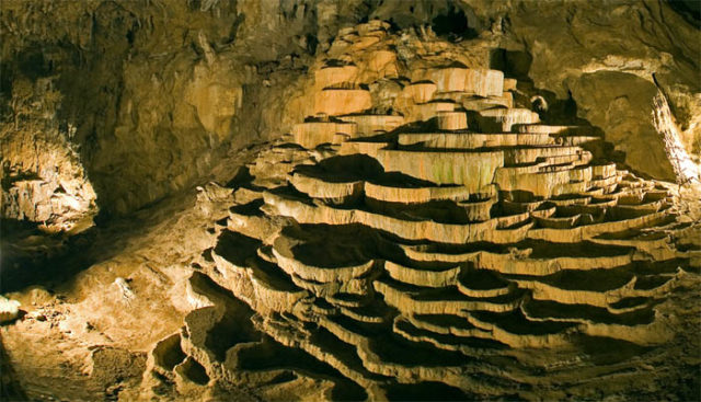 Terraces of precipitated calcium carbonate inside Škocjan Caves, Slovenia. Author: Lander CC BY-SA 3.0