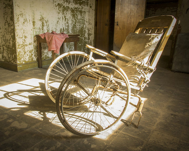 One of the wheelchairs of Pennhurst State School and Hospital. Photo Credit: Thomas, CC BY-SA 2.0. 